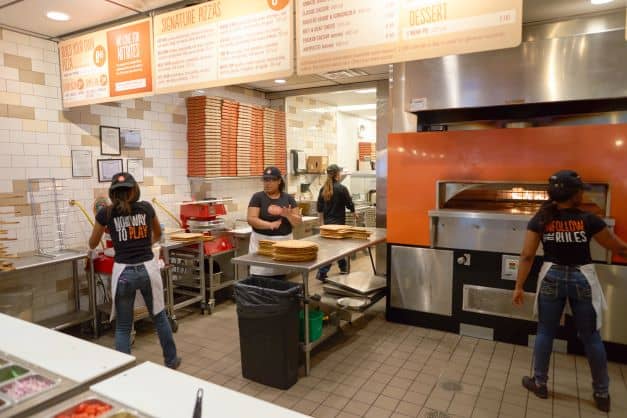 Blaze pizza kitchen with employees working